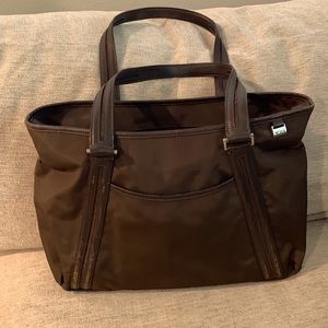 Tumi brown tote/briefcase bag, 2 outside 3 inside pockets, leather trim